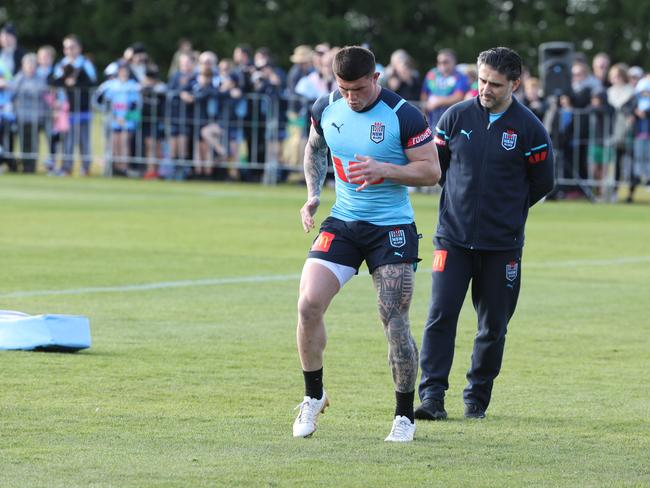 The NSW physio keeps an eye on Bradman Best during a fitness session prior to training. Picture: Rohan Kelly