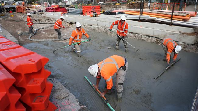 Concrete is poured on the Devonshire St stretch of the light rail project in Surry Hills. Picture: Brett Costello