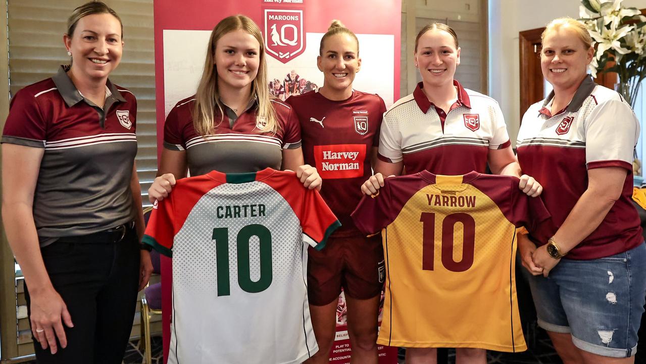 Lillian Yarrow receives her Queensland Country jersey from Australian and Brisbane Broncos' star Ali Brigginshaw (centre).