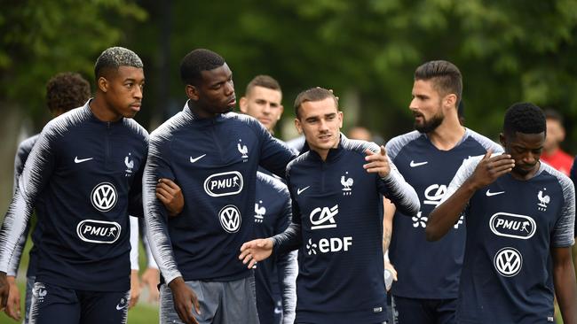 (L-R) France's defender Presnel Kimpembe, midfielder Paul Pogba, forward Antoine Griezmann, forward Olivier Giroud, and forward Ousmane Dembele arrive for a training session at the French national football team's training grounds.