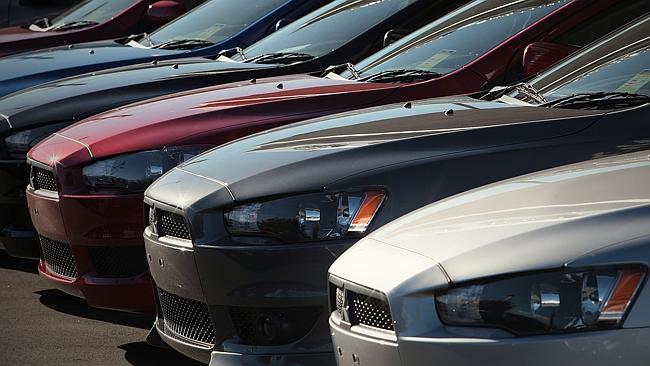 Industry needs surety ... New cars sit waiting for owners. Picture: Patrick Hamilton