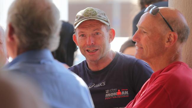 Tony Abbott went out for a surf at North Steyne before coffee with friends yesterday. Picture: John Grainger