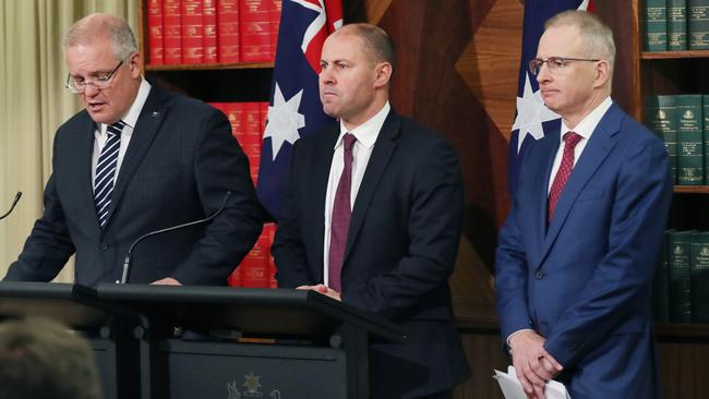 Prime Minister Scott Morrison, Treasurer Josh Frydenberg and Minister for Communications, Cyber Safety and the Arts Paul Fletcher during a press conference in Melbourne on Thursday.