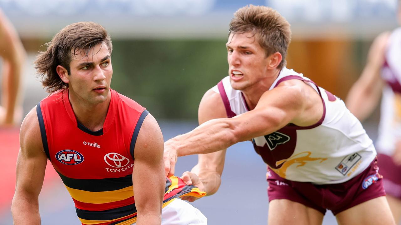 Josh Rachele under pressure from Brisbane’s Zac Bailey.