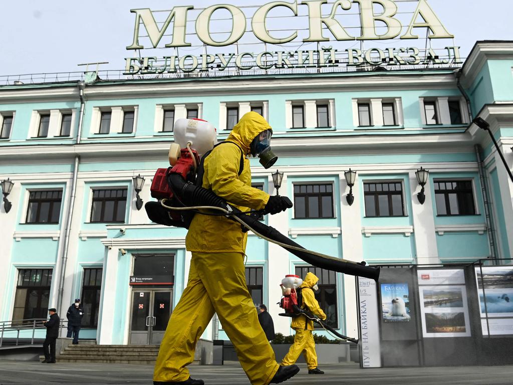 Workers disinfect Moscow's Belorussky railway station amid the ongoing pandemic. Vaccination rates in Russia are “unfortunately low” said Vladimir Putin. Picture: AFP