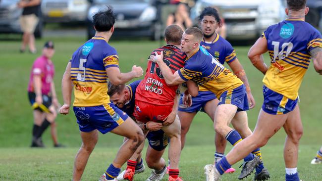 Kolbi Wood held in a tackle. Picture: DC Sports Photography