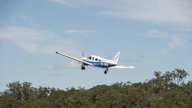 EXPRESS ADVOCATE/AAP. Pilot Tony Moffatt takes off in his Piper Saratoga plane with another excited family at Warnervale on Saturday, 9 November, 2019. Central Coast Aero Club held their annual Fun Fly Day at Warnervale Airport where families got free scenic flight flights over the Central Coast. (AAP IMAGE / Troy Snook)