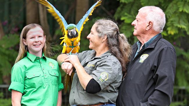 Madeline, Steph and Steve Robinson with 12-month-old Ninja the Macaw at Darling Downs Zoo. Pic Tara Croser.