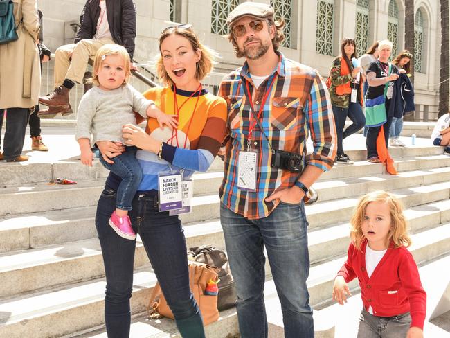 Olivia Wilde and Jason Sudeikis with Daisy and Otis in 2018. (Photo by Presley Ann/WireImage)