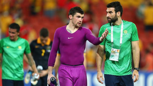 Ryan talks with Mile Jediank after the Socceroos’ loss to South Korea.