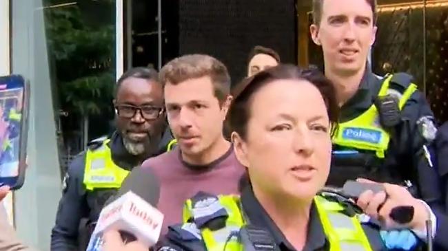 Anthony Andolfo was hauled out of the same building he scaled by police after scaling 56-levels. Picture: 9NEWS.