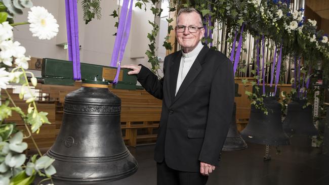 Fr Peter Williams, the dean of St Patrick's Cathedral Parramatta, with some of eight bells which have been imported from the UK. Picture: Dylan Robinson