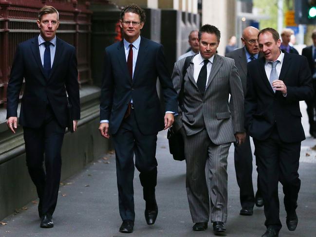 Lawyer Justin Quill, Herald Sun editor Damon Johnston, reporter Anthony Dowsley and deputy editor Chris Tinkler arrive at the Supreme Court in 2014.