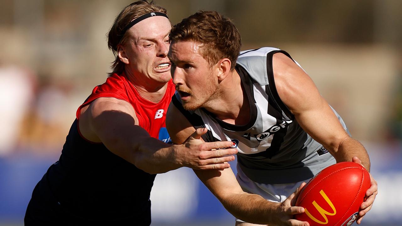 Kane Farrell tries to evade Charlie Spargo. Picture: Michael Willson/AFL Photos via Getty Images