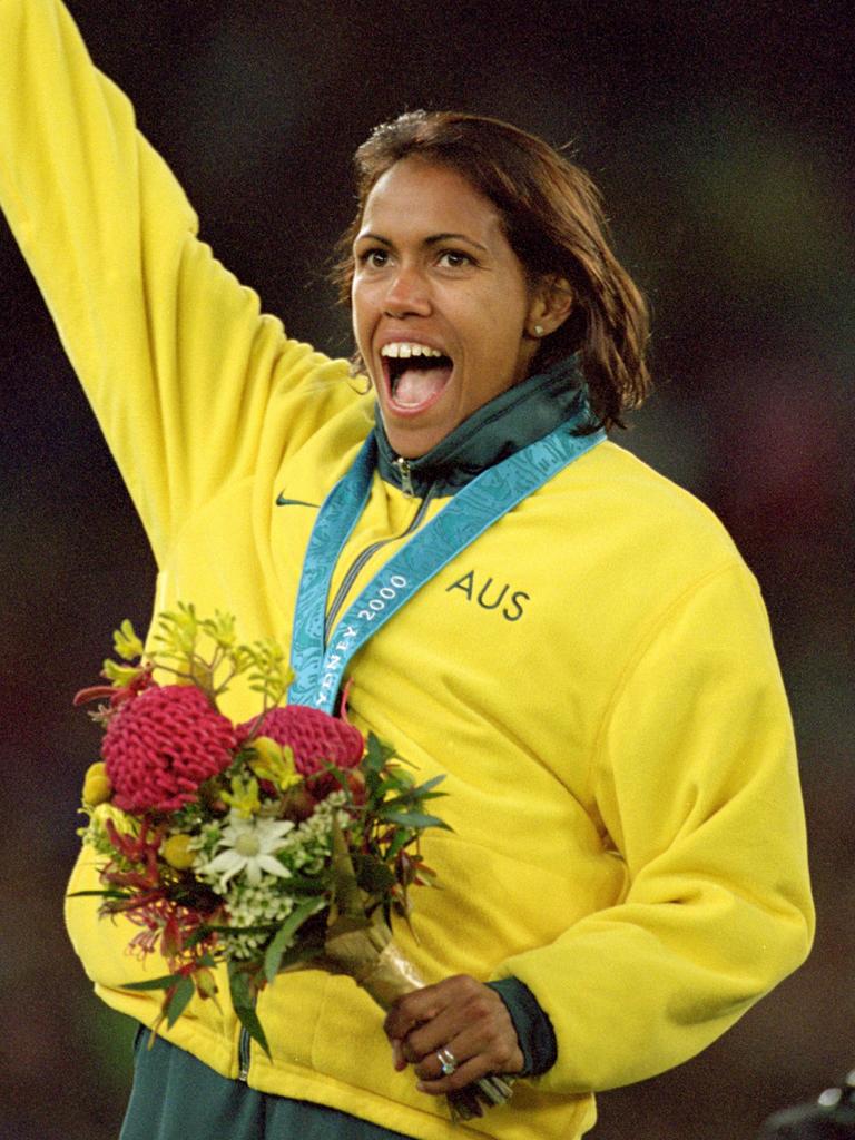 Cathy Freeman celebrates winning gold in the Women’s 400m at the Sydney 2000 Olympic Games. Picture: Stu Forster /Allsport