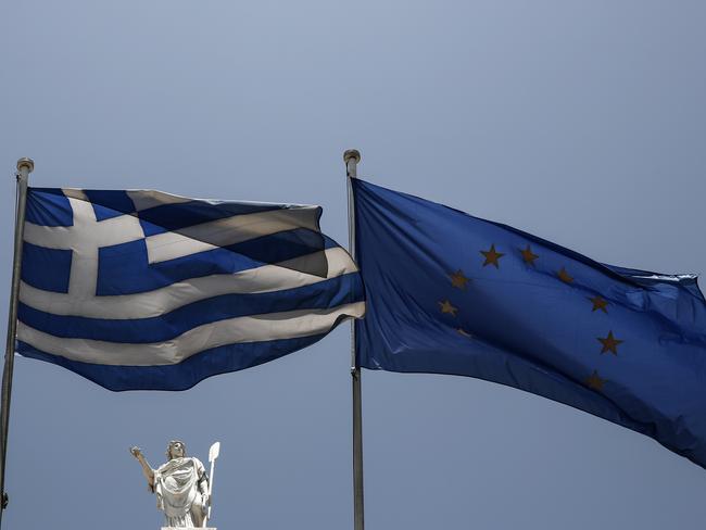 Together for now — Greece may be forced to exit the eurozone if leaders can’t agree to bail out terms. Picture: AP Photo/Yorgos Karahalis.