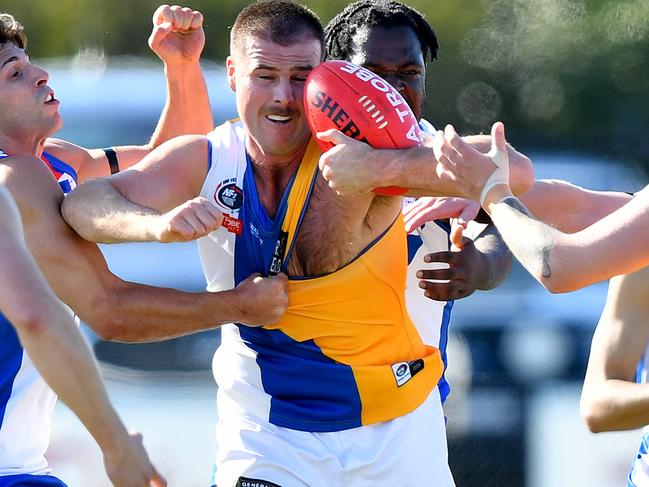 Jake Chiminello of Macleod is tackled during the round three NFNL Division 1 Melbourne Greyhounds Seniors match between West Preston-Lakeside and Macleod at JE Moore Park Oval, on April 27, 2024, in Melbourne, Australia. (Photo by Josh Chadwick)