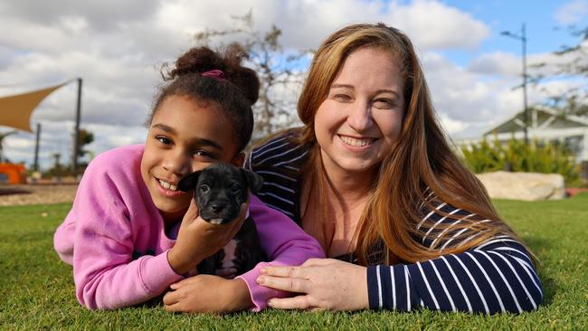 Riverlea residents Chloe and her daughter Lilly, 7, with their new puppy Leah. Picture: Supplied