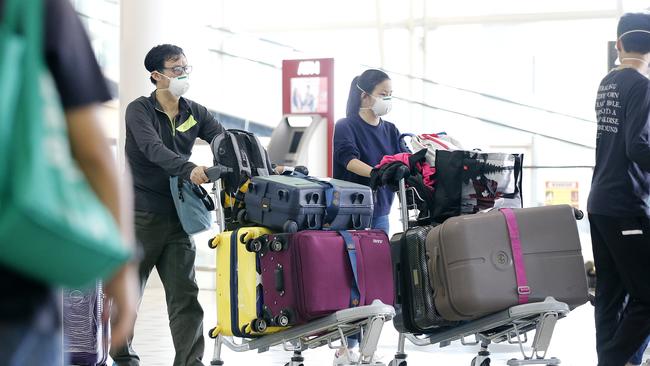 Passengers arriving in Brisbane from China and Hong Kong on February 4. Picture: Josh Woning/AAP