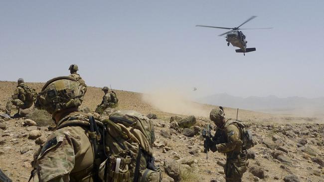 Australian Army soldiers from Special Operations Task Group prepare to be extracted by a US Army Black Hawk helicopter in Uruzgan province, southern Afghanistan, in 2012. Picture: Department of Defence