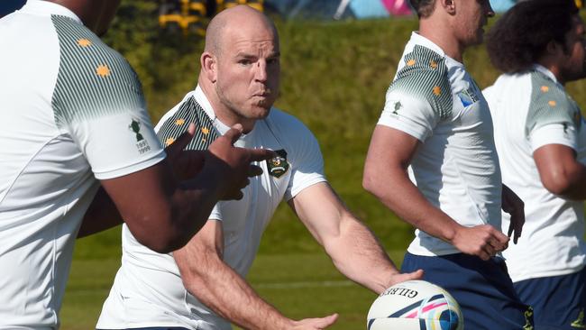 Australia's hooker and captain Stephen Moore catches a ball during a team training session at Bath University, south west England, on September 26, 2015 during the Rugby Union World Cup. AFP PHOTO / DAMIEN MEYER RESTRICTED TO EDITORIAL USE