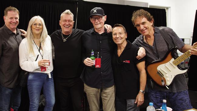 Former Cold Chisel manager Rod Willis (centre, with cap) at Bankwest Stadium, Parramatta, in 2020 with, from left, Cold Chisel co-manager John Watson, Willis’ wife Gay, Jimmy Barnes, Phil Small and Ian Moss. Picture: Robert Hambling