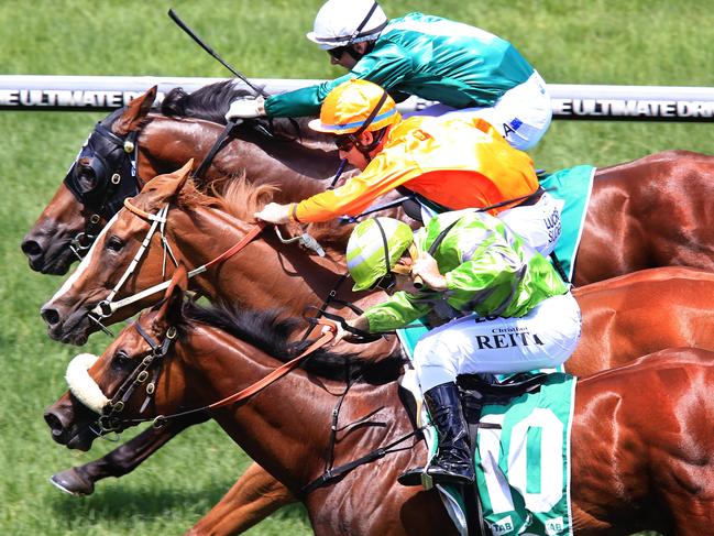 Euro Angel ridden by Tommy Berry, (orange) wins race 2 from Sonic Swish ridden by Christian Reith, ( light green) and Al Nader ridden by Brenton Avdulla  during Australia Day races at Royal Randwick racecourse. pic Mark Evans