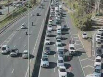 TMR traffic footage shows congestion from a multi-vehicle crash along the Pacific Highway at Grandis Street.