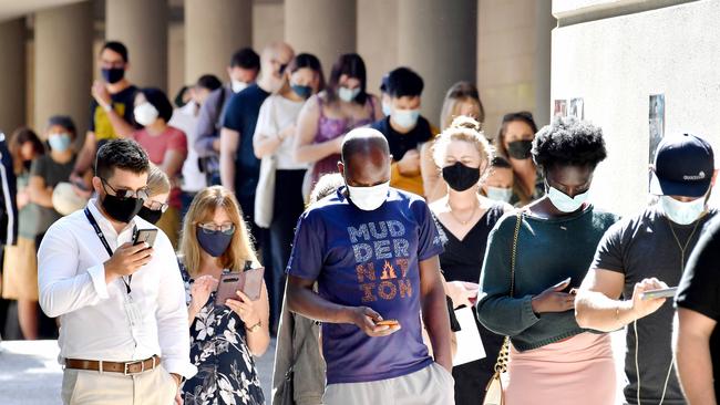 Lines of people at the Brisbane vaccination hub at Brisbane Convention and Exhibition Centre after a record-breaking weekend leads Queensland several steps closer to opening its borders. Picture: NCA NewsWire / John Gass