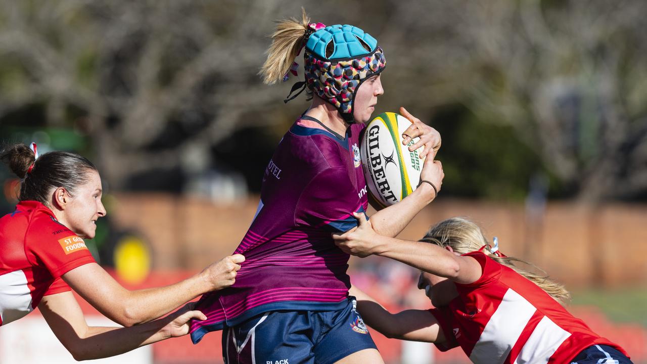 Bridgette Nicol (left) and Meg Jakins (right) of St George Roma tackle a Toowoomba Bears player in Downs Rugby Womens XV grand final rugby union at Toowoomba Sports Ground, Saturday, August 24, 2024. Picture: Kevin Farmer