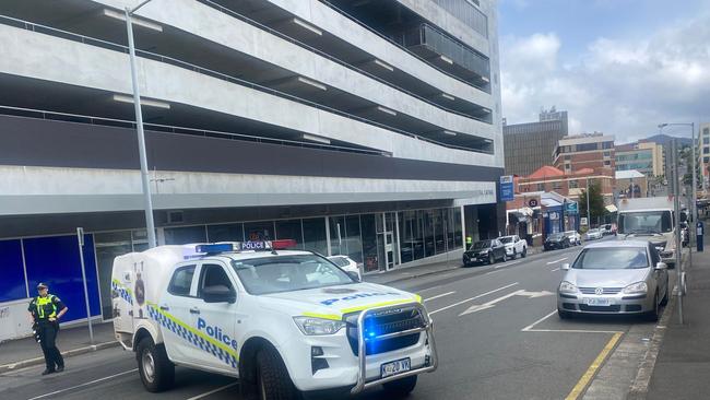 Police have closed and blocked off Bathurst St in Hobart's CBD as they respond to a "suspect article" incident inside Your Hobart Doctor. Photo: Judy Augustine