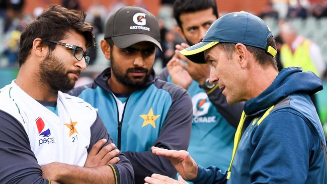 Justin Langer speaks to Pakistan players Imam-ul-Haq, left, and Babar Azam after the Test in Adelaide last December. Picture: AFP