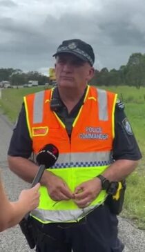 Senior Sergeant Tony McDowall speaking at a serious crash on the Bruce Highway near Balberra