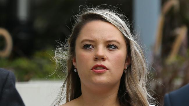 Amy Crisp arrives for the inquest into the Dreamworld disaster at the Magistrates Court at Southport. (AAP Image/David Clark)