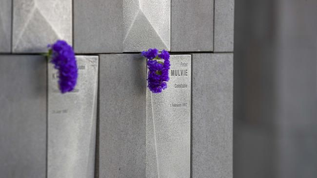 Flowers placed at the Botanical Gardens memorial to remember fallen officers on National Police Remembrance Day. Picture: Richard Walker