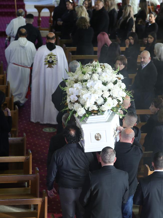 Lametta Fadlallah’s coffin is carried inside.