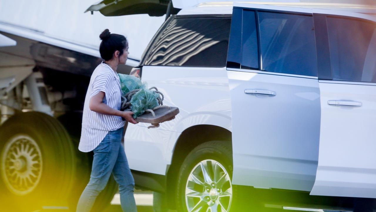 Prince Harry, Meghan Markle and their family - plus what appears to be some very precious cargo - arrive back in California. Picture: Maciel/BACKGRID