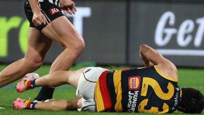 Izak Rankine reels from the Dan Houston bump. Picture: James Elsby/AFL Photos via Getty Images