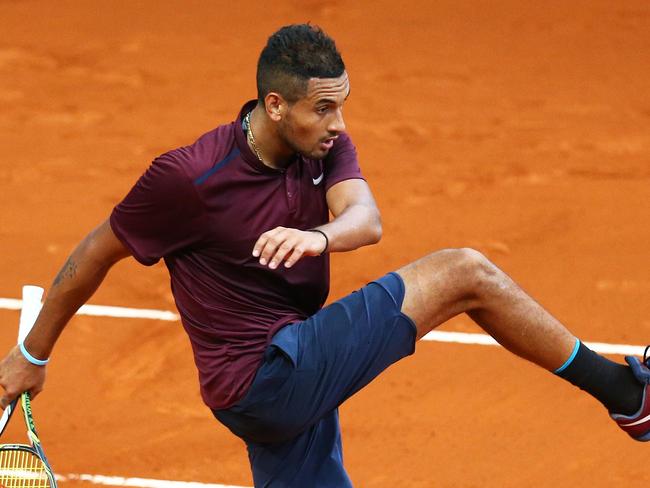 MADRID, SPAIN - MAY 06: Nick Kyrgios of Australia shows his emotions as he kicks the ball during his three set defeat against Kei Nishikori of Japan in their quarter final round match during day seven of the Mutua Madrid Open tennis tournament at the Caja Magica on May 06, 2016 in Madrid,Spain. (Photo by Clive Brunskill/Getty Images)