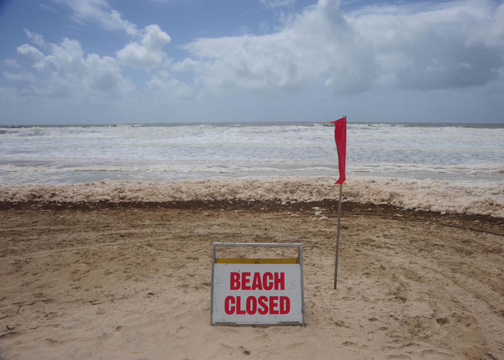 Foam covers Maroochydore Beach after heavy rain and large seas. Picture: Brett Wortman