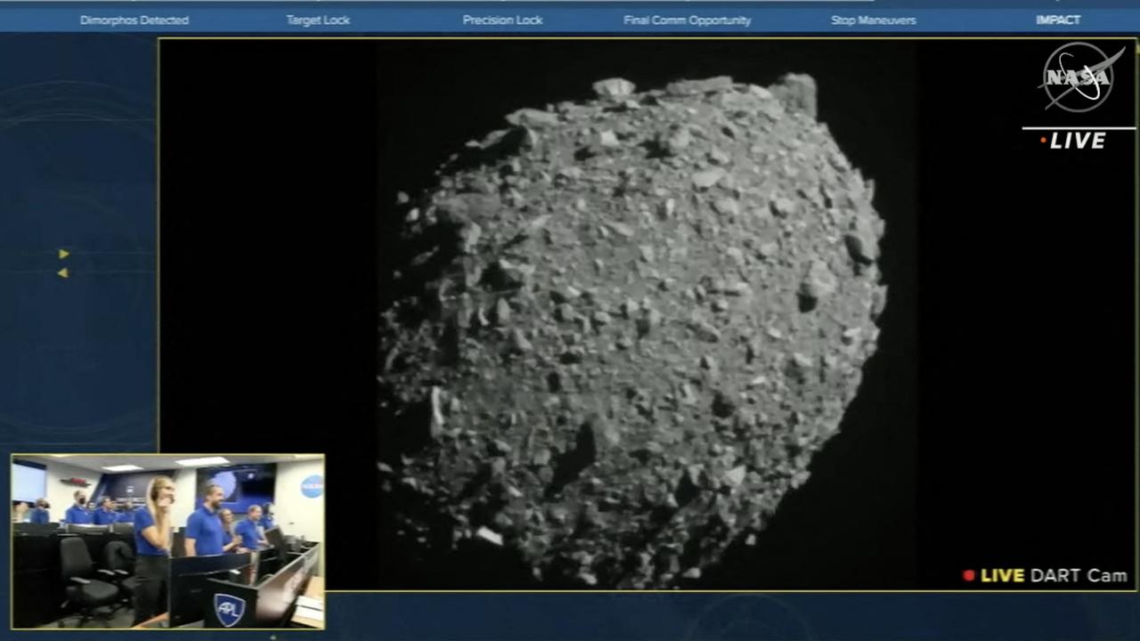 The NASA live feed on September 26, 2022, showed the test asteroid Dimorphos just before the Double Asteroid Redirection Test (DART) made impact with the asteroid, as watched by the NASA team, as seen bottom left. Picture: NASA/AFP