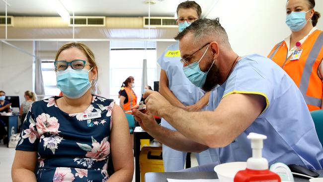 A woman gets the Covid-19 vaccination at tRoyal Prince Alfred Hospital Vaccination Hub. Picture: Toby Zerna