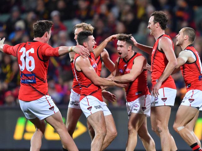 Will Snelling of the Bombers (third from right) celebrates a goal with teammates during the Round 18 AFL match against the Adelaide Crows at Adelaide Oval. Picture: AAP/David Mariuz