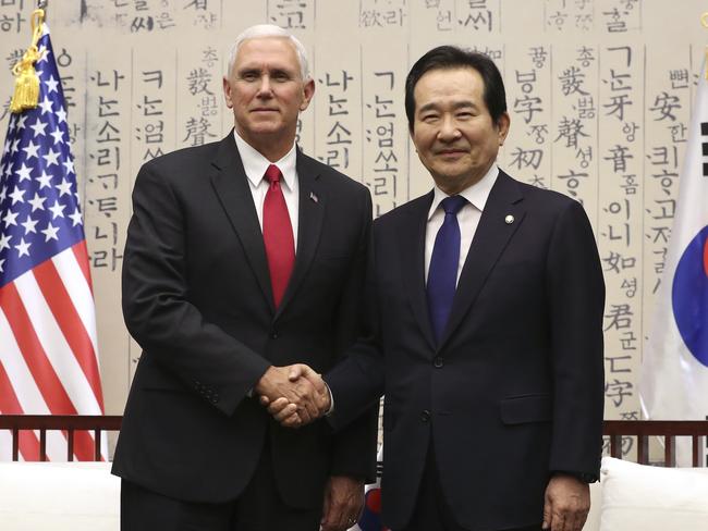 Mr Pence poses with South Korea’s National Assembly Speaker Chung Sye-kyun as he reassured US allies over the North Korea threat. Picture: Lee Jin-man/AP