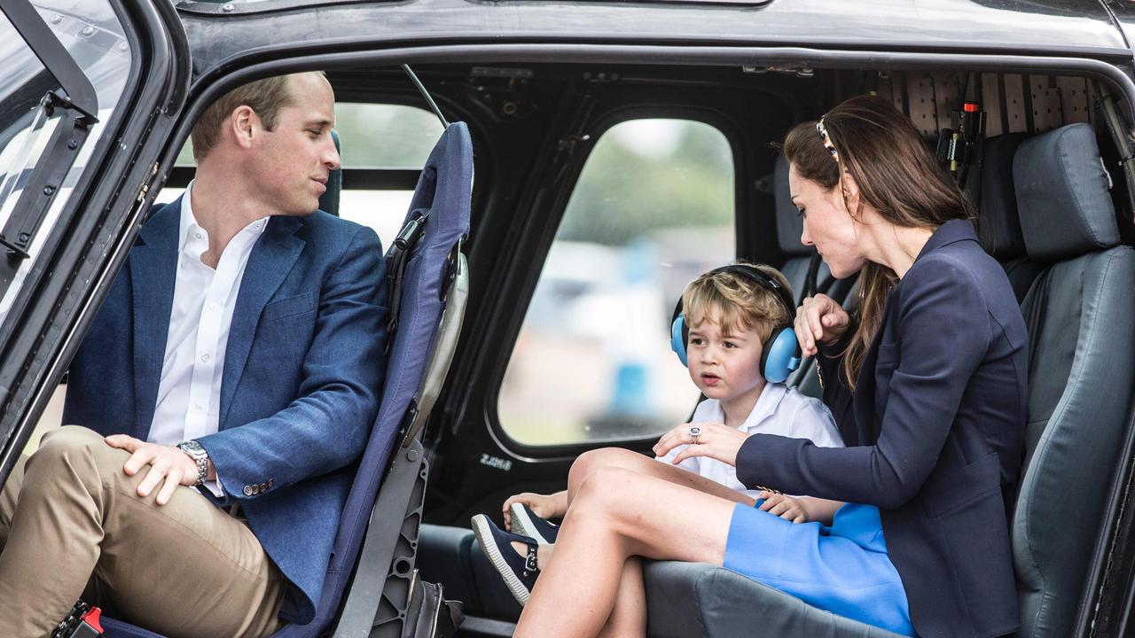 Prince William, Prince George and Kate Middleton in a helicopter in 2016. Picture: Richard Pohle/AFP