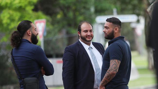 Zachariah Obeid (left) talking with his brother Ihab Obeid (right) and his lawyer (middle) outside Wyong Local Court at an earlier appearance. Picture: Sue Graham