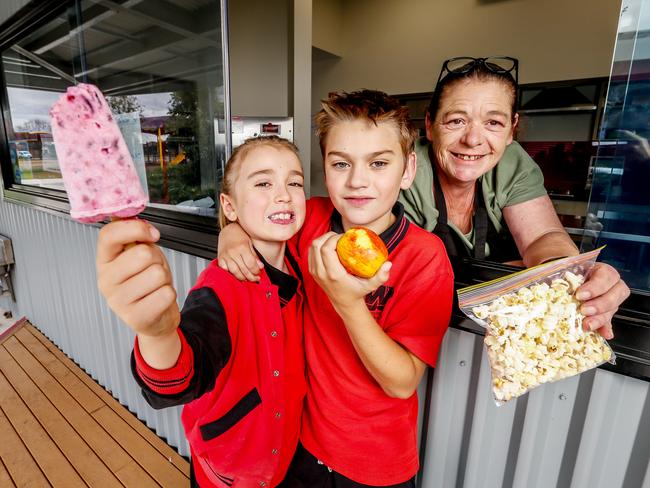 Pupils  Charlie and Chris with Canteen Assistant Bridget Kille at Westbreen Primary School in Melbourne’s Pascoe Vale. Picture: Tim Carrafa