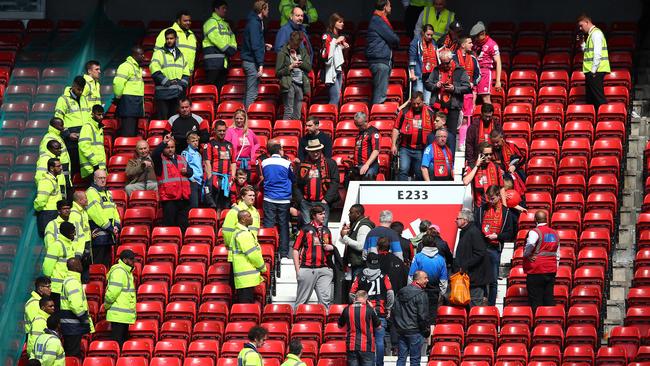 MANCHESTER, ENGLAND - MAY 15: Fans are evacuated from the ground as the match is abandoned ahead of the Barclays Premier League match between Manchester United and AFC Bournemouth at Old Trafford on May 15, 2016 in Manchester, England. (Photo by Alex Livesey/Getty Images) *** BESTPIX ***