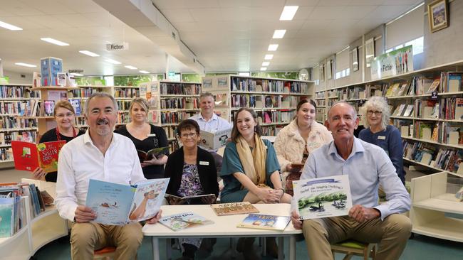 Clarence MP Chris Gulaptis and Richmond Valley Mayor Robert Mustow surrounded by Casino Library staff.