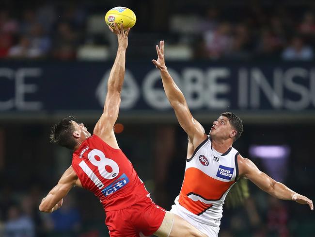 Sinclair gets his hand to the ball before Giant Jonathon Patton. Pic: Getty Images